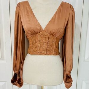 New brown satin long-sleeve corset-style top with a lace-up detail.